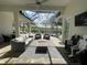 Relaxing lanai with a screened-in enclosure, offering serene golf course views at 15618 Castle Park Ter, Lakewood Ranch, FL 34202