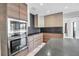 Sleek modern kitchen features high-end stainless steel appliances and stone countertops at 1649 Stanford Ln, Sarasota, FL 34231