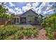 Gray house with a screened porch and a partially visible backyard at 1775 Southwood St, Sarasota, FL 34231