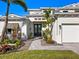 Front entry of a two-story house with white siding at 1827 Morris St, Sarasota, FL 34239