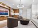 Gathering room with built-ins, comfortable seating, and a large TV at 1827 Morris St, Sarasota, FL 34239