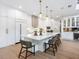 Spacious kitchen with white cabinets, island, and pendant lights at 1827 Morris St, Sarasota, FL 34239