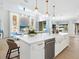 Open concept kitchen with large island and stainless steel appliances at 1827 Morris St, Sarasota, FL 34239