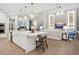 White kitchen with island, stainless steel appliances, and open layout at 1827 Morris St, Sarasota, FL 34239