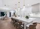 Modern kitchen with white cabinets, a large island, and pendant lighting at 1827 Morris St, Sarasota, FL 34239