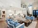Open concept living room with hardwood floors and two blue armchairs at 1827 Morris St, Sarasota, FL 34239