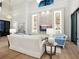 Living room features a large sofa, built-in shelving, and high ceilings at 1827 Morris St, Sarasota, FL 34239