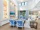 Living room with built-in shelving, stone fireplace, and blue chairs at 1827 Morris St, Sarasota, FL 34239