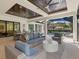 Comfortable outdoor living space with sectional sofa and large windows at 1827 Morris St, Sarasota, FL 34239