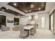 Outdoor kitchen with dining area, stainless steel appliances, and ceiling fans at 1827 Morris St, Sarasota, FL 34239
