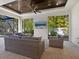 Spacious outdoor patio with seating area and flat screen TV at 1827 Morris St, Sarasota, FL 34239