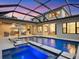 Expansive pool and spa with covered patio and outdoor seating at 1827 Morris St, Sarasota, FL 34239