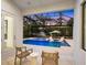 Relaxing pool area with lounge chairs and a covered patio at 1827 Morris St, Sarasota, FL 34239