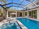 Relaxing pool and spa with covered patio and comfortable seating at 1827 Morris St, Sarasota, FL 34239