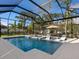 Inviting pool and spa area with a covered patio and lounge chairs at 1827 Morris St, Sarasota, FL 34239