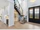 Elegant staircase with glass railings and modern design at 1827 Morris St, Sarasota, FL 34239