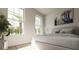 Bright bedroom featuring large windows, neutral decor, and plush bedding creating a serene retreat at 217 S Shade Ave, Sarasota, FL 34237
