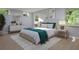 Serene bedroom with a plush bed, stylish decor, and large windows at 217 S Shade Ave, Sarasota, FL 34237