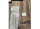 Sample of home tile including wood-look tile, marble square, white subway tile, and wood trim at 217 S Shade Ave, Sarasota, FL 34237