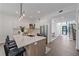 Modern kitchen with island seating and stainless steel appliances at 2248 Novus St, Sarasota, FL 34237