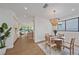 Modern dining room with wooden table and access to kitchen at 2248 Novus St, Sarasota, FL 34237