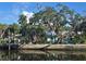 Charming waterfront home with lush landscaping and private dock at 2427 Walker Cir, Sarasota, FL 34234