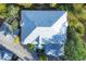 Aerial view of house, showing metal roof and landscaping at 294 Hidden Bay Dr # 203, Osprey, FL 34229
