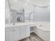 Primary bathroom with large mirror and soaking tub at 294 Hidden Bay Dr # 203, Osprey, FL 34229