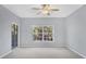 Bedroom with large window and ceiling fan at 294 Hidden Bay Dr # 203, Osprey, FL 34229