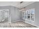 Dining room with hardwood floors and a modern light fixture at 294 Hidden Bay Dr # 203, Osprey, FL 34229