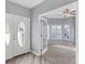 Bright entryway with double doors and view into a sunlit room at 294 Hidden Bay Dr # 203, Osprey, FL 34229