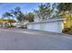 Three-car garage with automatic doors and extra storage at 294 Hidden Bay Dr # 203, Osprey, FL 34229