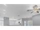 Open kitchen with white cabinets, stainless steel appliances, and an island at 294 Hidden Bay Dr # 203, Osprey, FL 34229