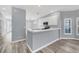 Modern kitchen with white cabinets and stainless steel appliances at 294 Hidden Bay Dr # 203, Osprey, FL 34229