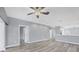 Bright living room featuring hardwood floors and a ceiling fan at 294 Hidden Bay Dr # 203, Osprey, FL 34229