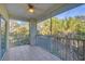 Spacious screened porch with ceiling fan and sliding glass door at 294 Hidden Bay Dr # 203, Osprey, FL 34229