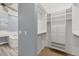Bright walk-in closet with built-in shelves and drawers at 294 Hidden Bay Dr # 203, Osprey, FL 34229