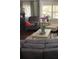 Relaxing living room featuring hardwood floors, comfortable seating, and ample natural light at 3218 Ramblewood N Dr # 19C2, Sarasota, FL 34237