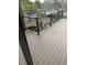 Composite deck with metal railings overlooking backyard at 3218 Ramblewood N Dr # 19C2, Sarasota, FL 34237