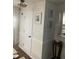 Clean and bright entryway with white trim and wood floors at 3218 Ramblewood N Dr # 19C2, Sarasota, FL 34237
