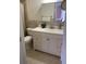 Clean bathroom with white vanity and tiled floors at 3218 Ramblewood N Dr # 19C2, Sarasota, FL 34237