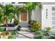 Welcoming entrance with a wooden door and stone pathway at 3631 San Remo Ter, Sarasota, FL 34239