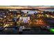 Waterfront home at dusk with private boat dock at 3631 San Remo Ter, Sarasota, FL 34239