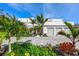 Modern home with palm trees, a paved driveway and stylish design at 3631 San Remo Ter, Sarasota, FL 34239