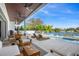 Relaxing pool deck with lounge chairs, offering water views at 3631 San Remo Ter, Sarasota, FL 34239