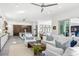 Bright living room with white sofas and access to backyard at 3631 San Remo Ter, Sarasota, FL 34239