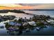 Luxury waterfront property at sunset with amazing water views at 3631 San Remo Ter, Sarasota, FL 34239