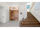 Elegant entryway with wood staircase and double doors at 3631 San Remo Ter, Sarasota, FL 34239