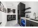 Laundry room with modern appliances and wine cooler at 3631 San Remo Ter, Sarasota, FL 34239