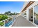Long rooftop deck with pool and water views at 3631 San Remo Ter, Sarasota, FL 34239